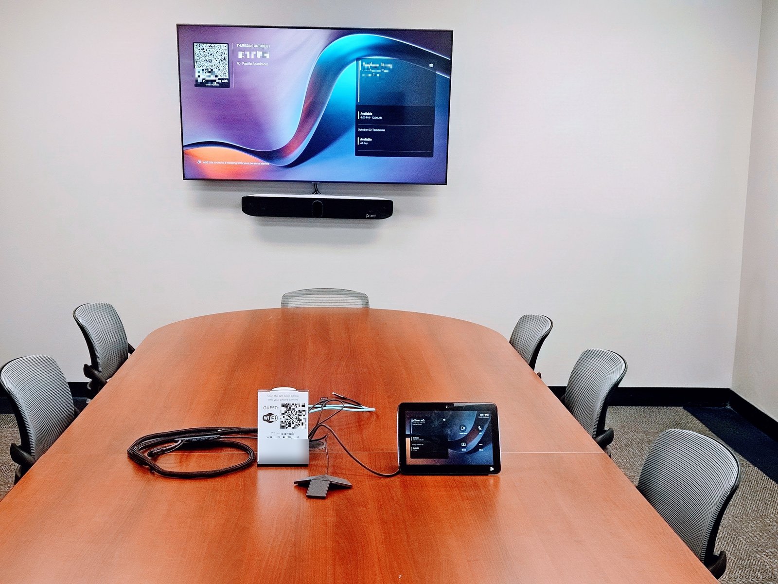 Conference Room Set Up Ottawa - AV Geeks Microsoft Teams Room boardroom install in Ottawa: Poly Studio X72 video bar under the TV with TC10 touch controller and table mic